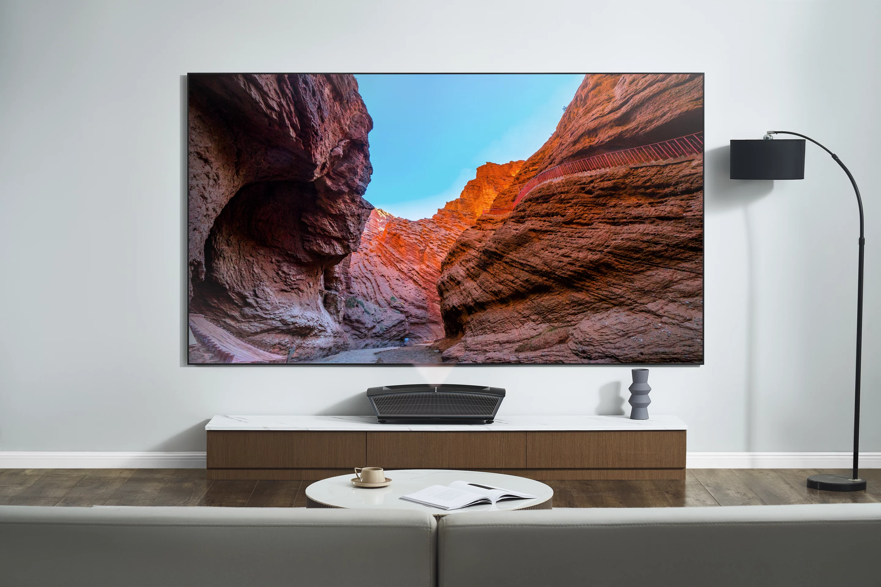 The Casiris H6 4K Tri-Color laser projector can throw 120-inch visuals at 13.6 inches away from the display surface