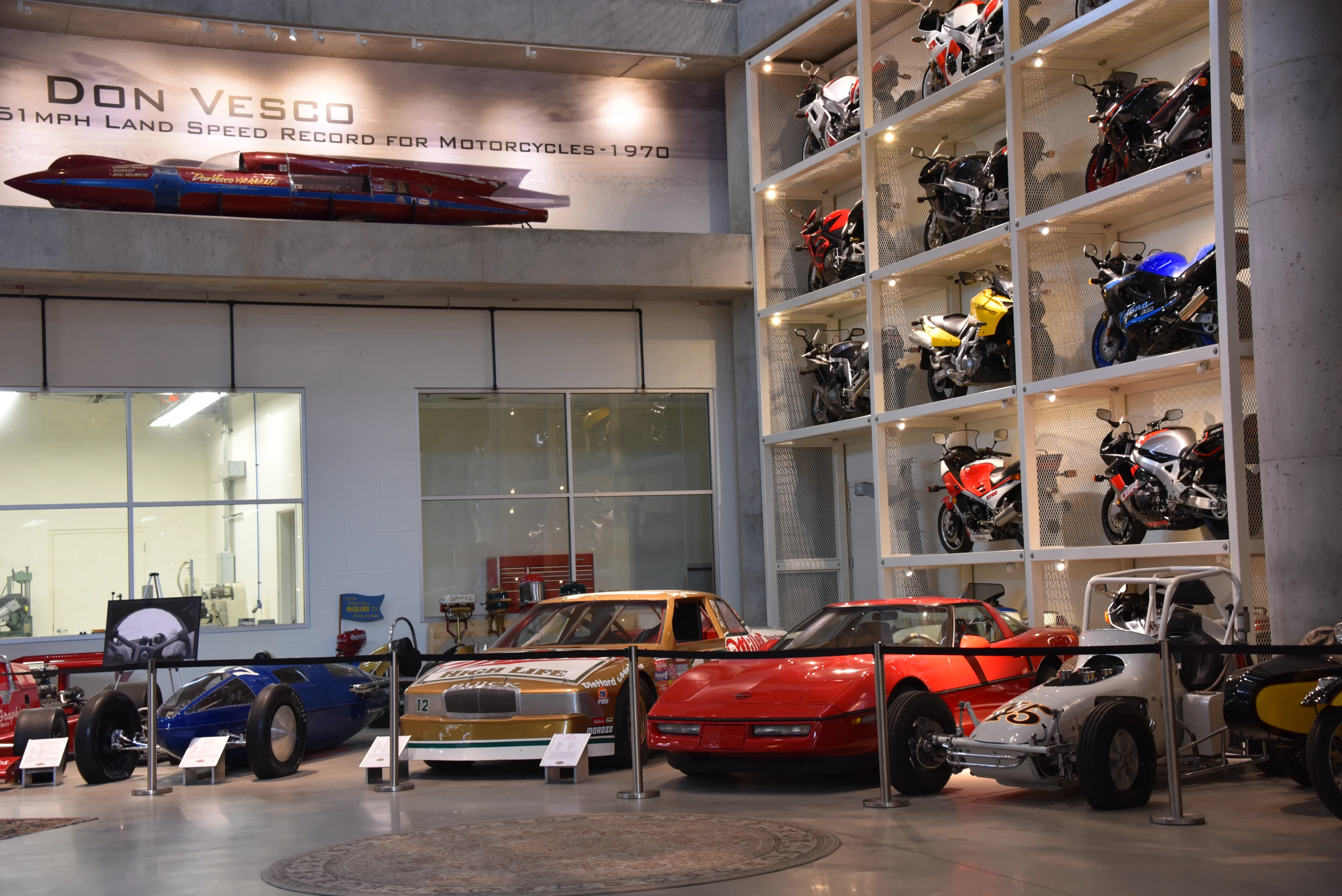 Vintage race cars outside the basement workshop