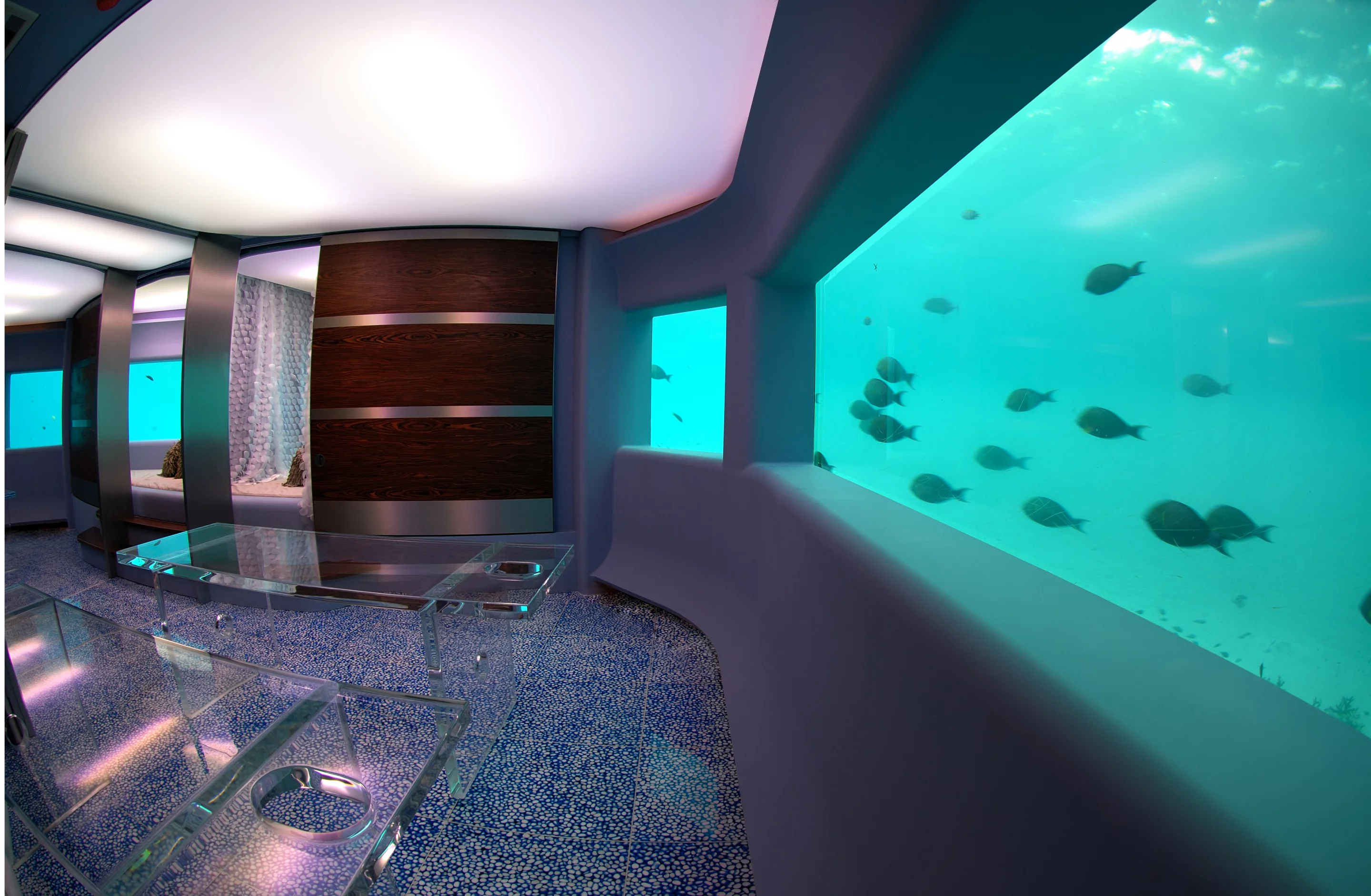 Visitors enter the submarine spa via an underwater corridor