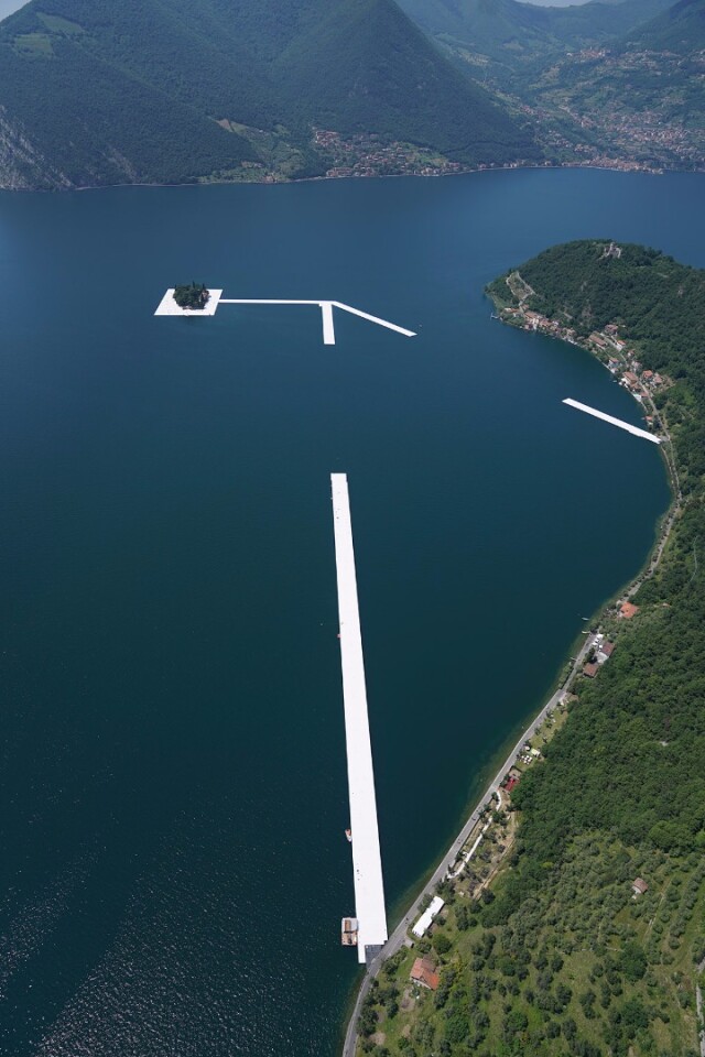One by one, workers install the 100 by 16 meter sections to connect the island of San Paolo with the island of Monte Isola
