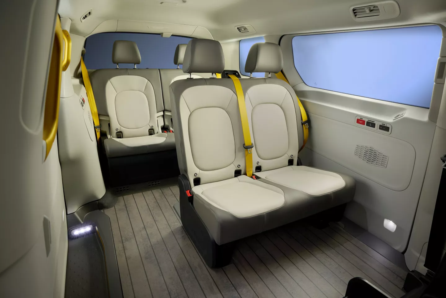The van has a simple interior with only four passenger seats