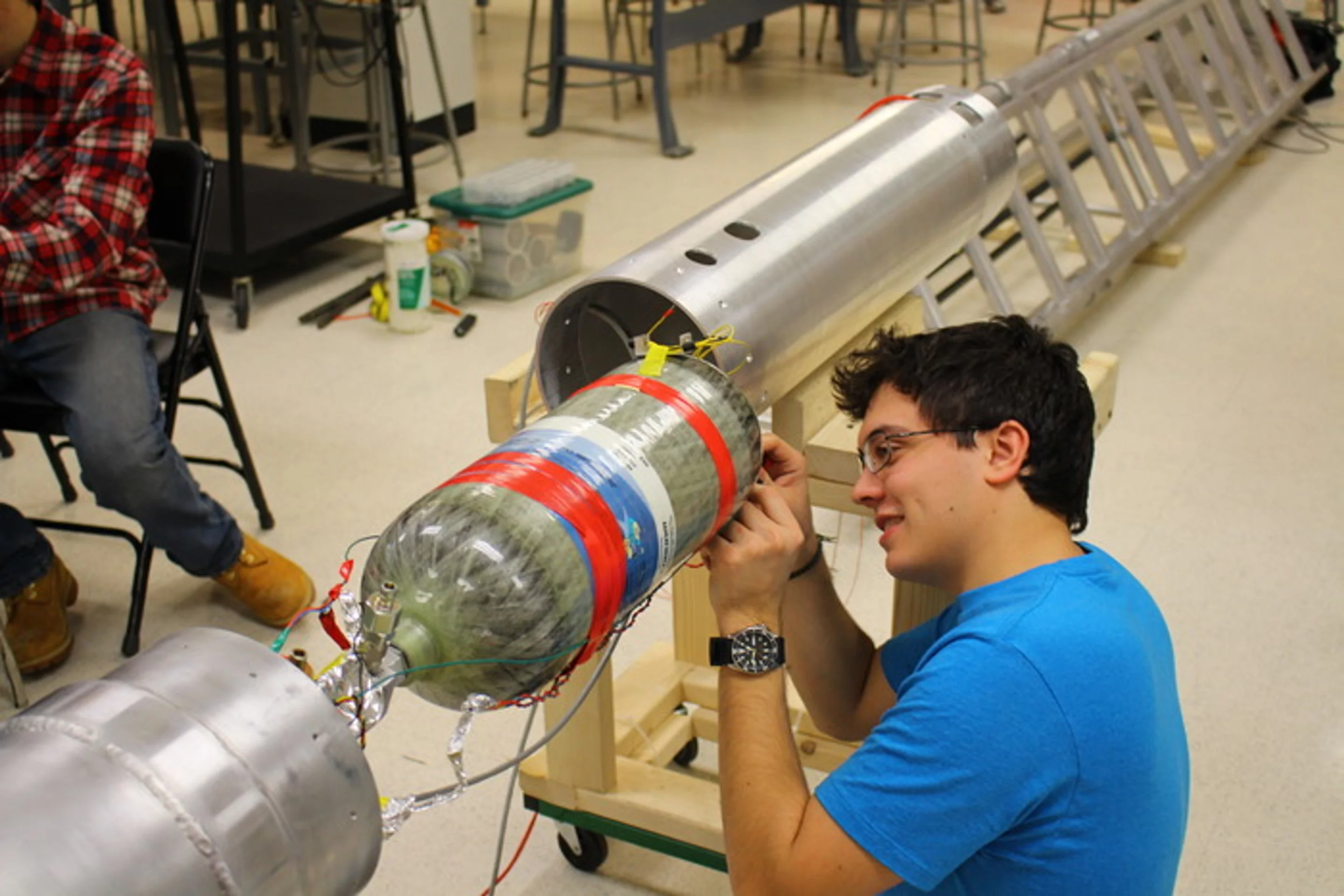 Student installing electronics on the Mk IV motor
