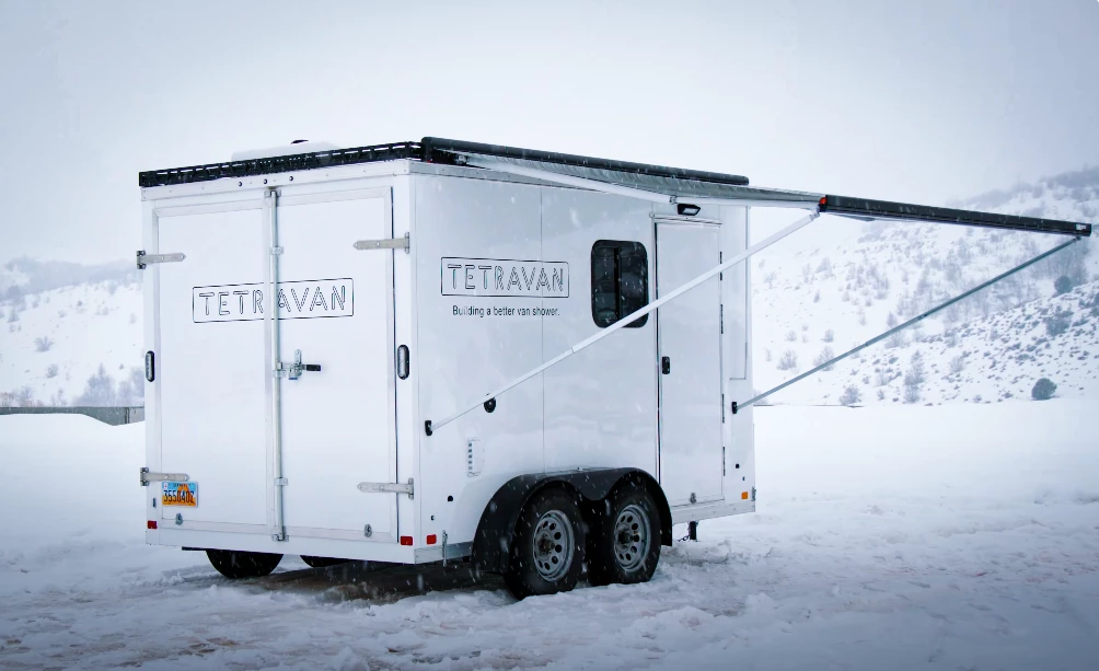 The Tetravan trailer includes a Fiamma awning, powder-coated aluminum roof rack and solar panels on its exterior