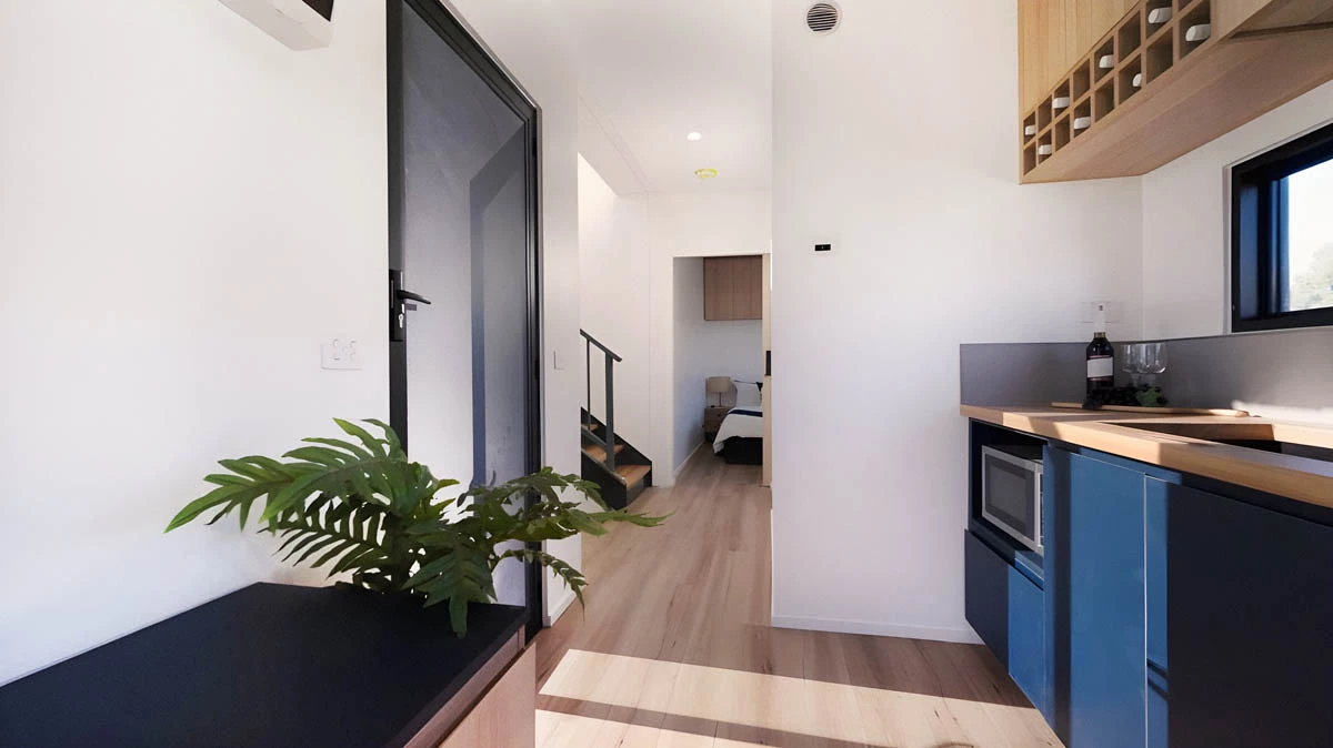 The Mark T's interior looks relatively spacious for a container-based house and is arranged around a central kitchen