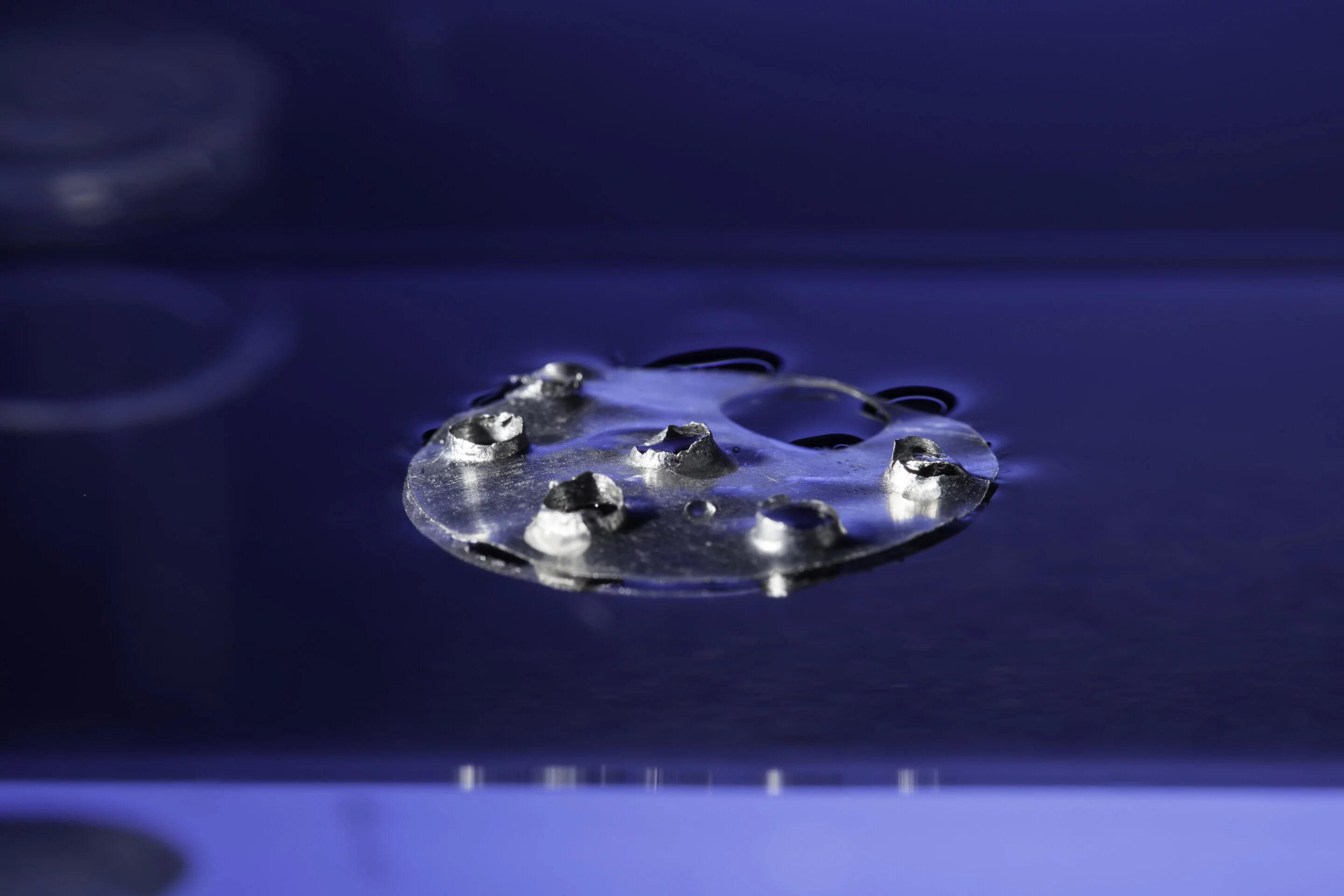 The unsinkable metal continues to float even after having holes drilled in it