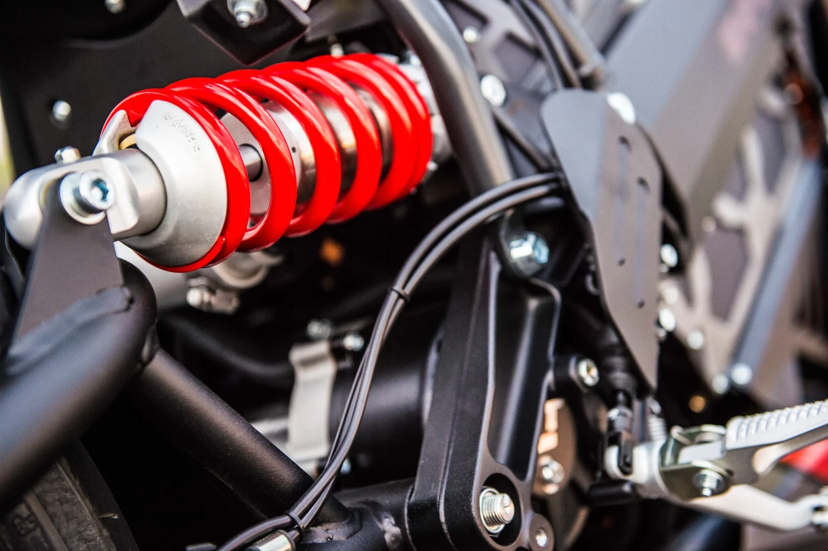 The adjustable rear shock absorber is made by Sachs