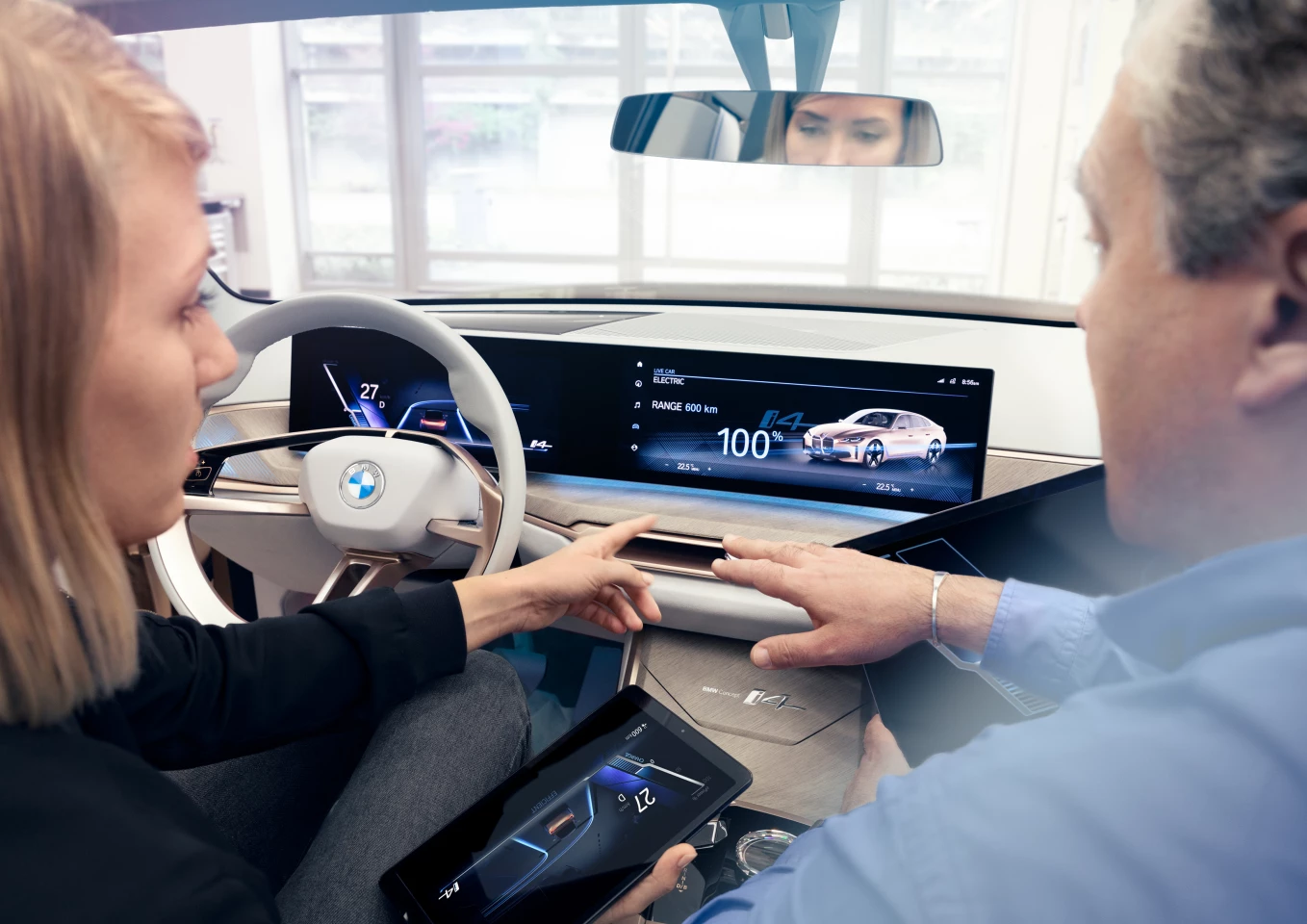 The combined instrument panel and control screen is angled toward the driver