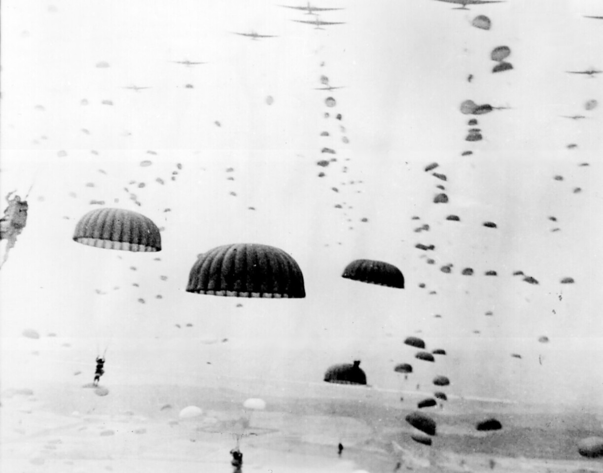 By WWII, parachute technology had matured to mainstream status and a well-trained human could safely jump from an aircraft in flight ... then fight. This was a game-changer. The parachute transformed ground warfare as it could put elite soldiers anywhere and this became one of the cornerstones of the battle plan for Operation Overlord: to airdrop large numbers of of skilled combatants not just behind enemy lines, but to destroy strategic targets across France and disrupt the defense supply lines.