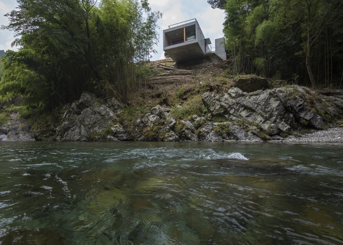 Faced with almost no flat surface to build a structure on architect Masato Sekiya designed an incredible concrete cantilevered cabin. A marvel of structural engineering this small home floats above the Tenkawa river in Japan