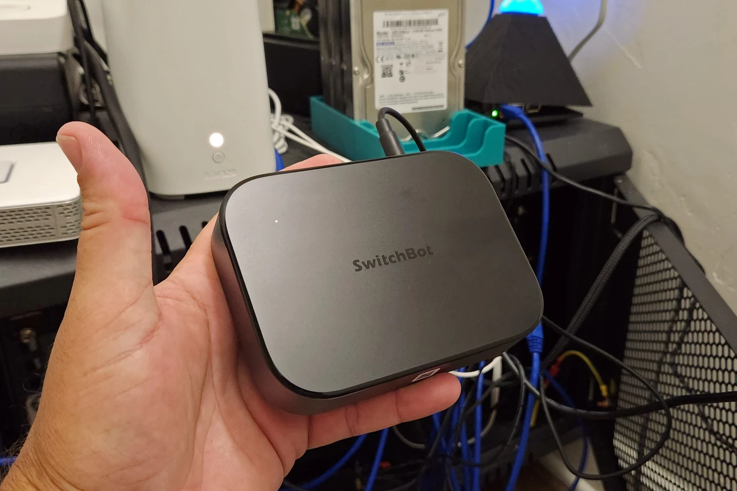 The Switchbot is a pretty compact, non-descript little unit. Super low power too.