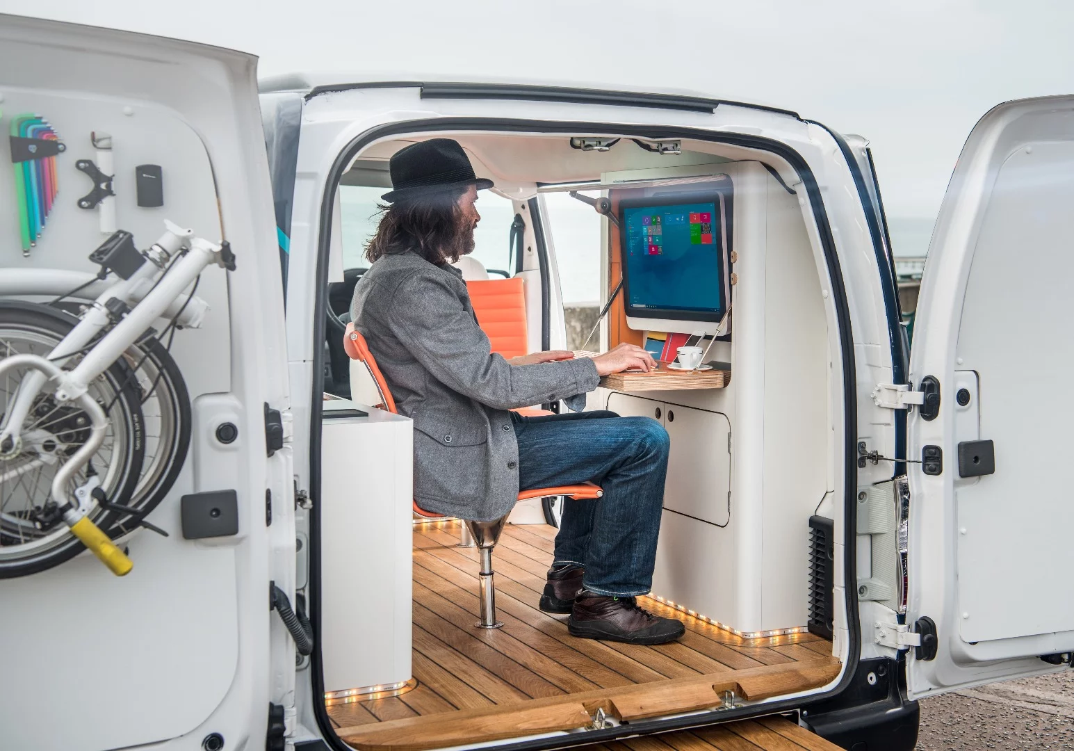 The desk includes a touchscreen computer