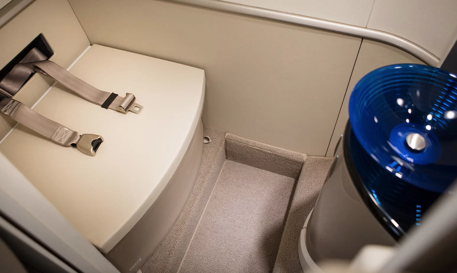 Belted lavatory inside the HondaJet Elite