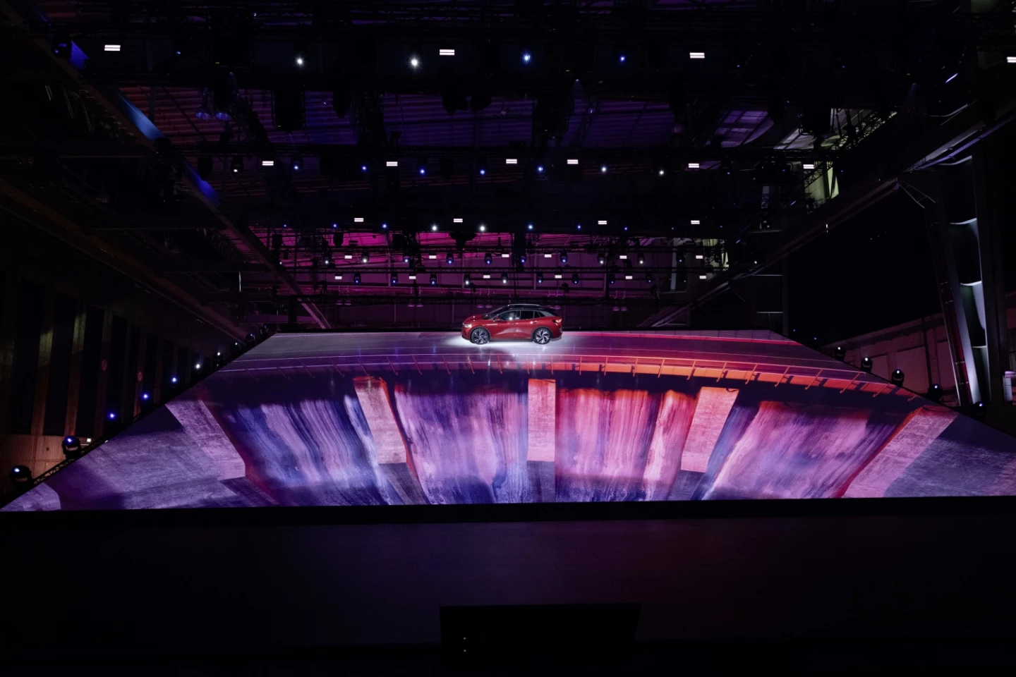 Volkswagen uses its mixed reality backdrop to drive the ID.4 GTX over a narrow bridge