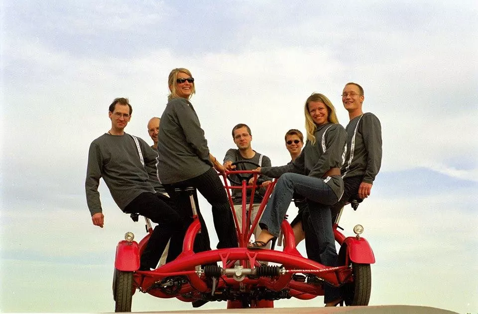 Up to six pedalers and one person at the helm