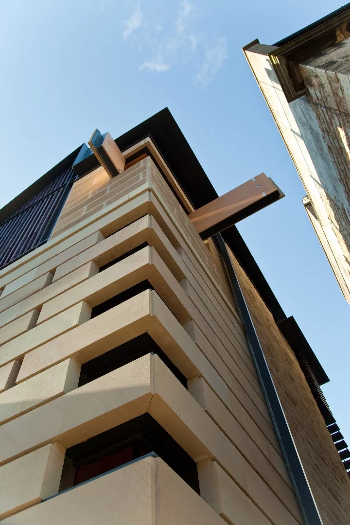 Inside, Richard Murphy included novel interior design touches like pulleys and levers which move sections of wall to open up the home to the sun