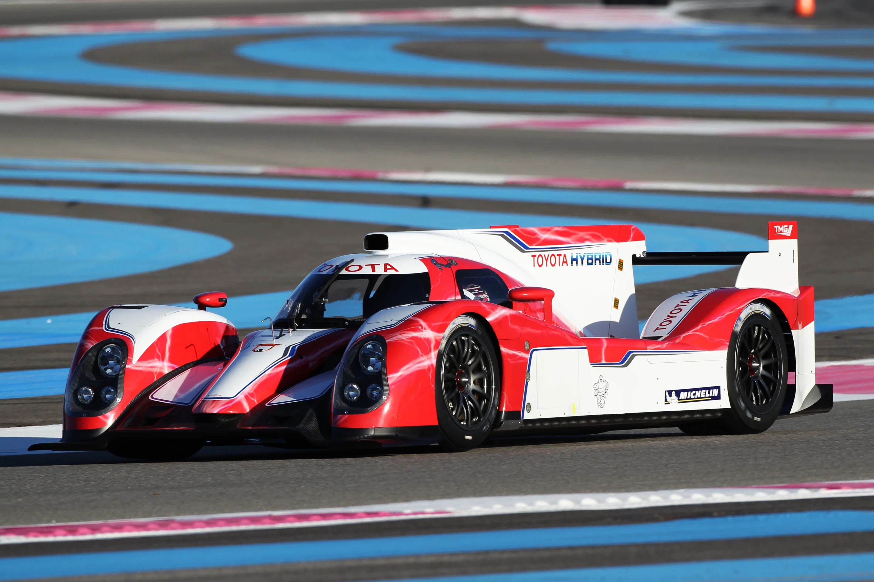 Toyota's TS030 Hybrid sports car on track at the Paul Ricard circuit.