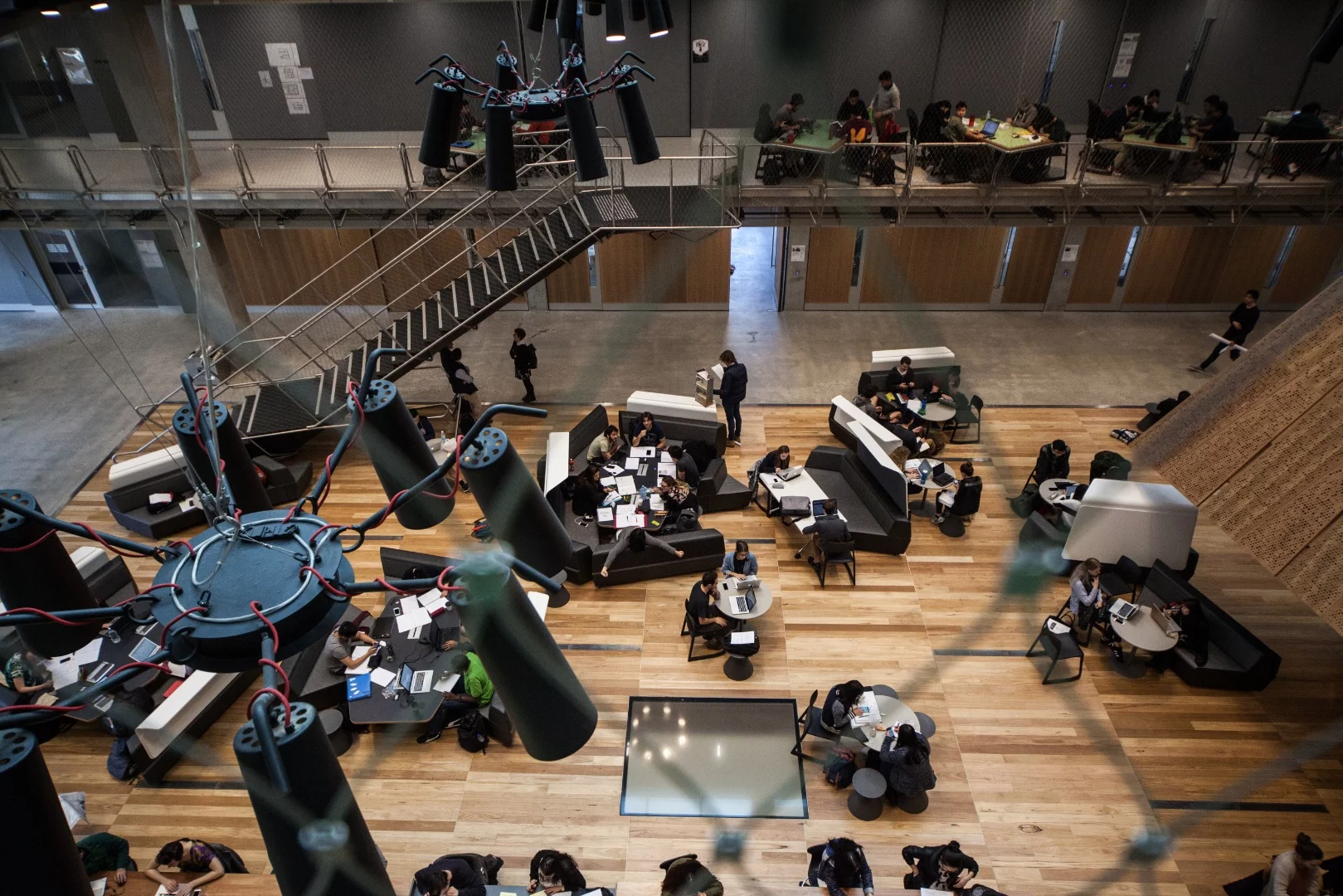 Many aspects of the building are left uncovered such as the mesh balustrades, bare concrete surfaces and exposed stairways