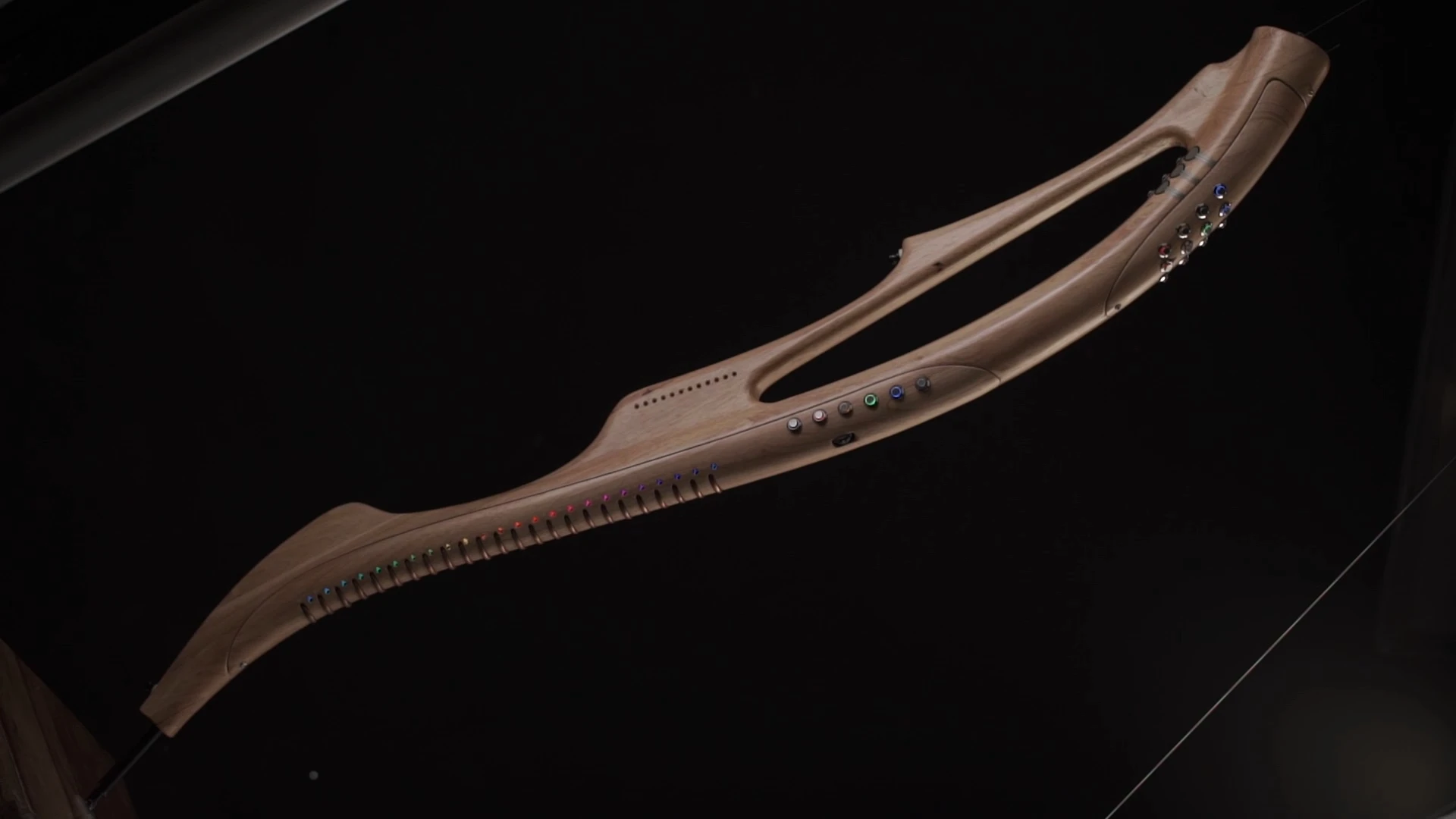 The 120 cm (47 in) long, 5 kg (11 lb) instrument is made of hardwood and combines high-end electronics, smart algorithms and an eye-catching, ergonomic design
