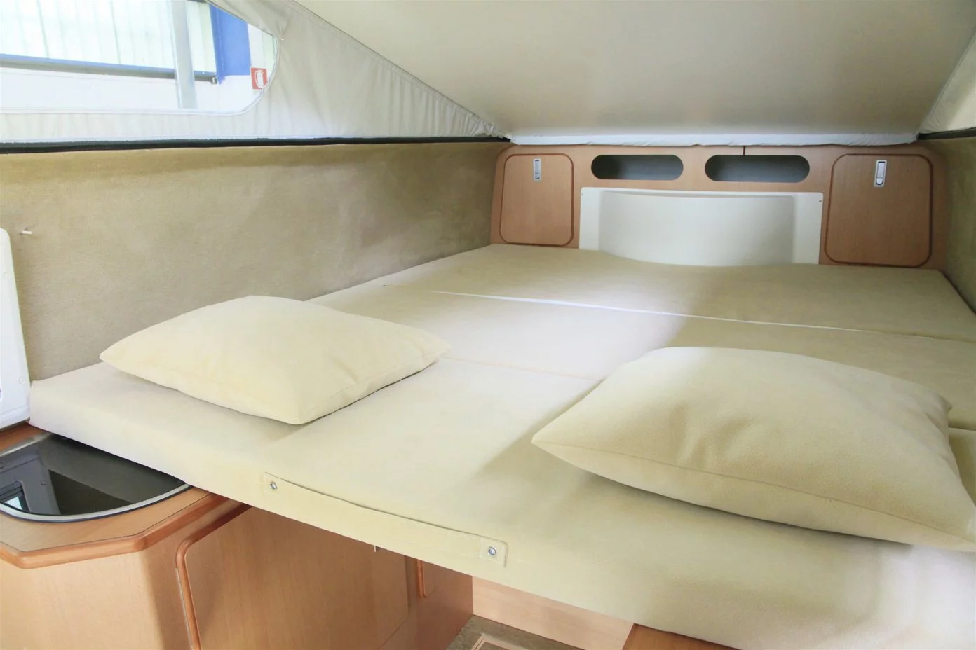 The king size bed folds out on the counters and sleeps one or two