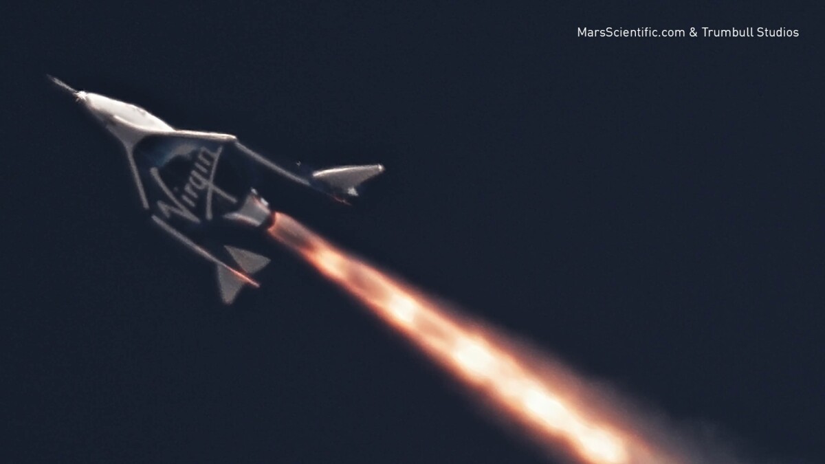 Virgin Galactic's tourist-carrying spaceplane's chemical rocket engine was fired for the first time today in the skies over the Sierra Nevada Mountains in California