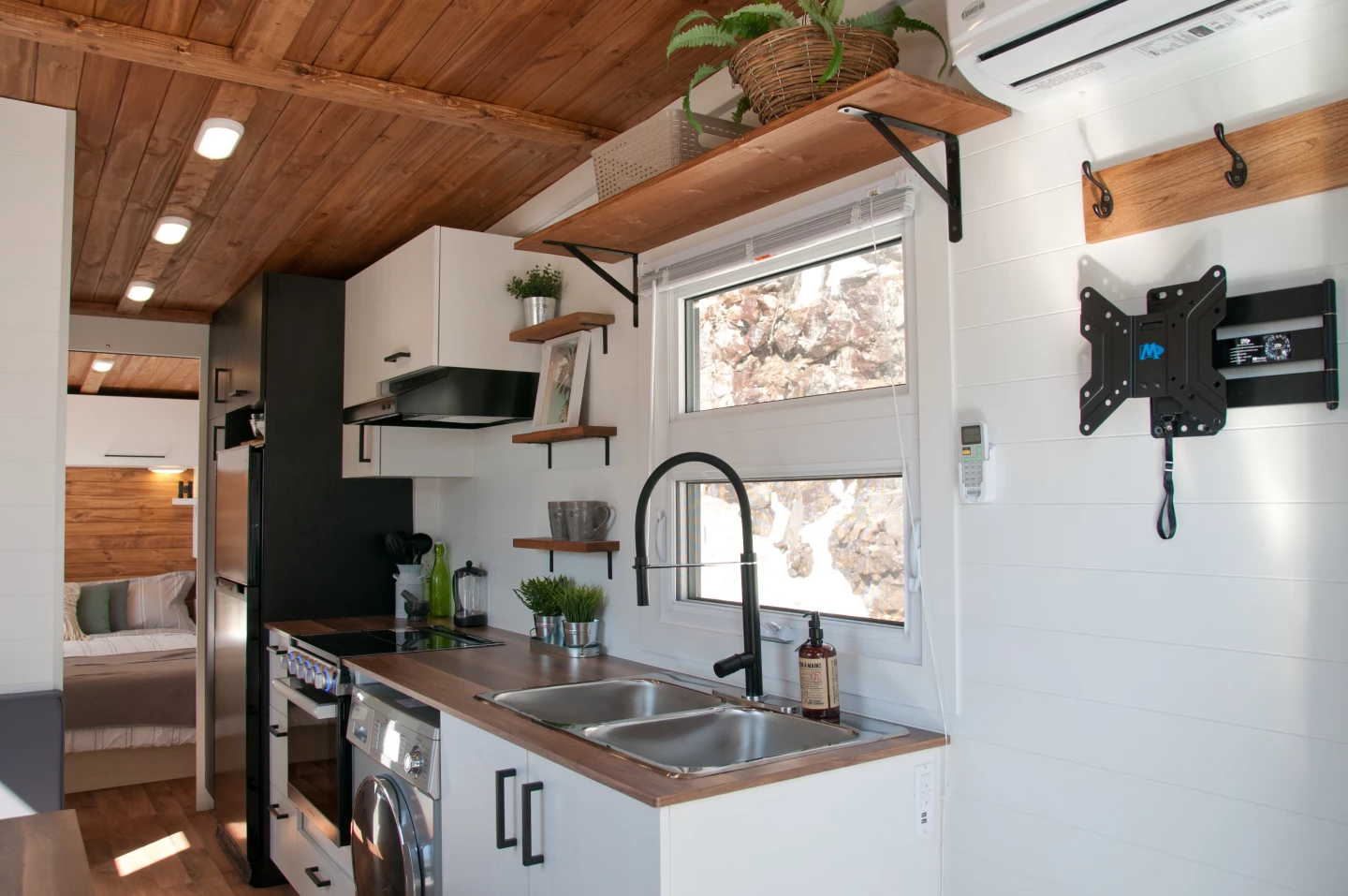 The Nomad's kitchen includes a propane-powered stove, an oven, and washer/dryer