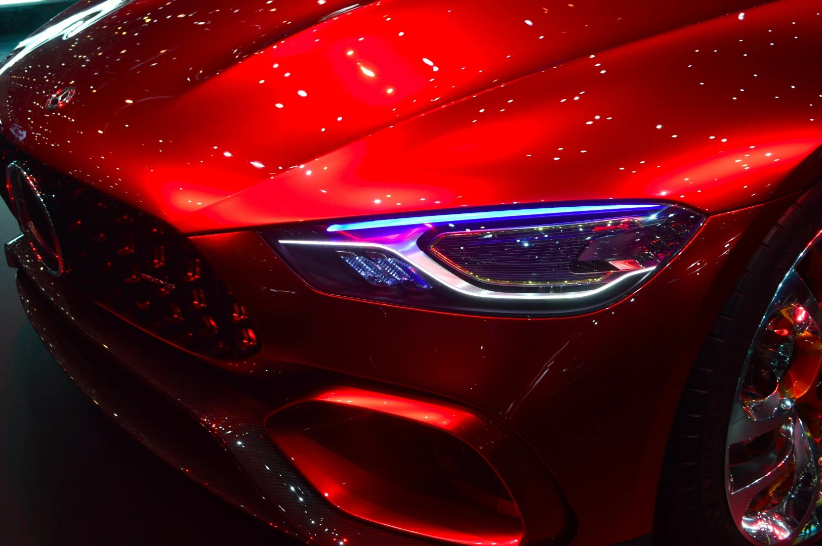 The Mercedes-AMG GT Concept's unique headlamp design combines new "nano active fiber technology" daytime running lamps, two light bars for illuminating the road directly ahead, a large LED main light and a fast-flashing turn signal at the upper edge