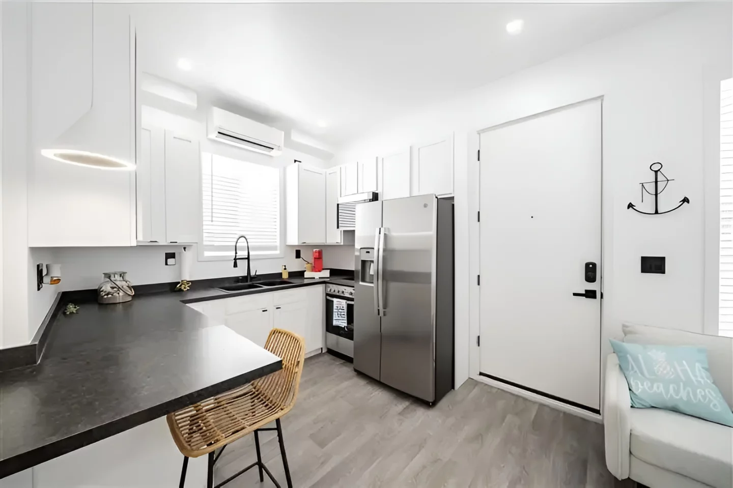 The kitchen has a full-size refrigerator and oven/stovetop