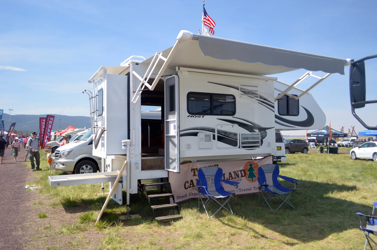 In addition to expedition vehicles and motor coaches, Host industries makes slide-out campers for trucks