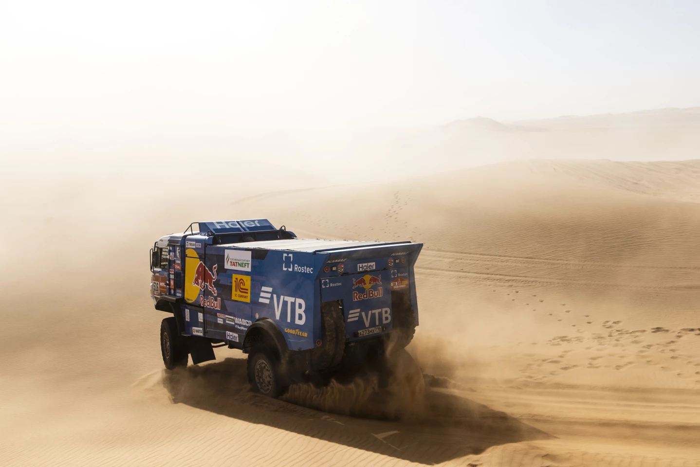 The colossal Kamaz truck of Anton Shibalov, Dmitri Niktin and Ivan Taterinov races into the silky dust of the desert on a loop around Wadi Al-Dawasir on stage 8
