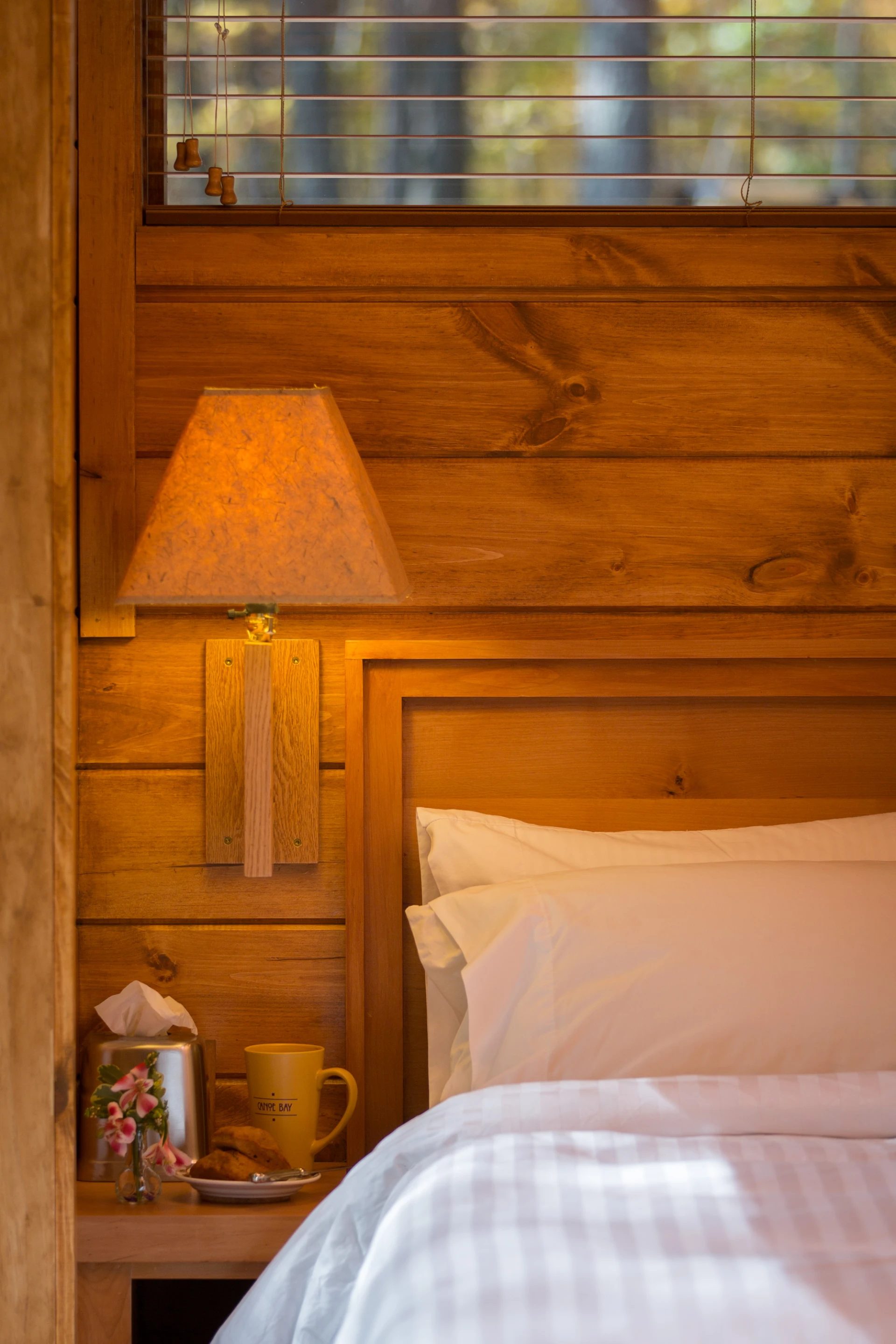 The interior contains a main living area, bathroom, separate W.C., bedroom, and a small kitchen area (Photo: Canoe Bay)