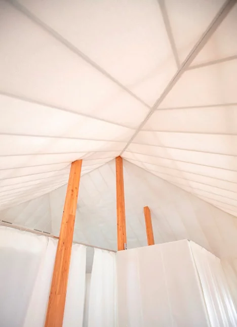 The semi-transparent facade encourages natural daylight working hours for occupants