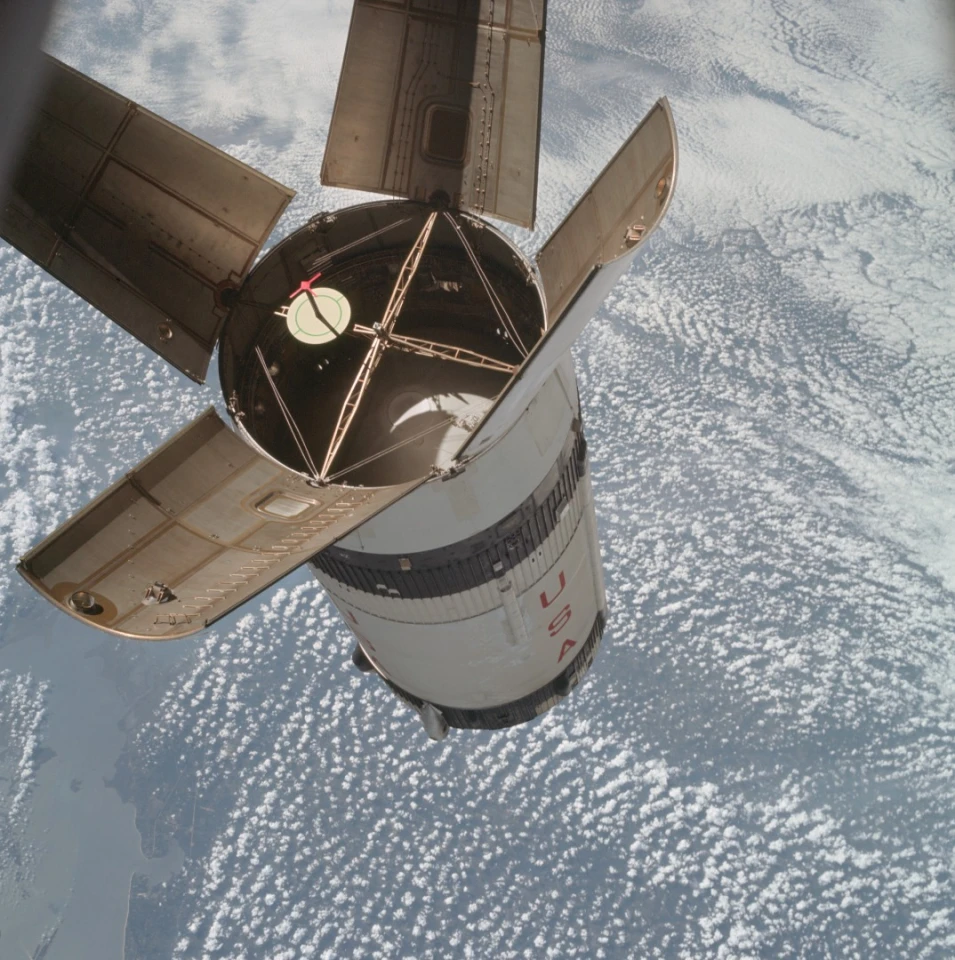 The expended Saturn IVB stage as photographed from the Apollo 7 spacecraft during transposition and docking maneuvers