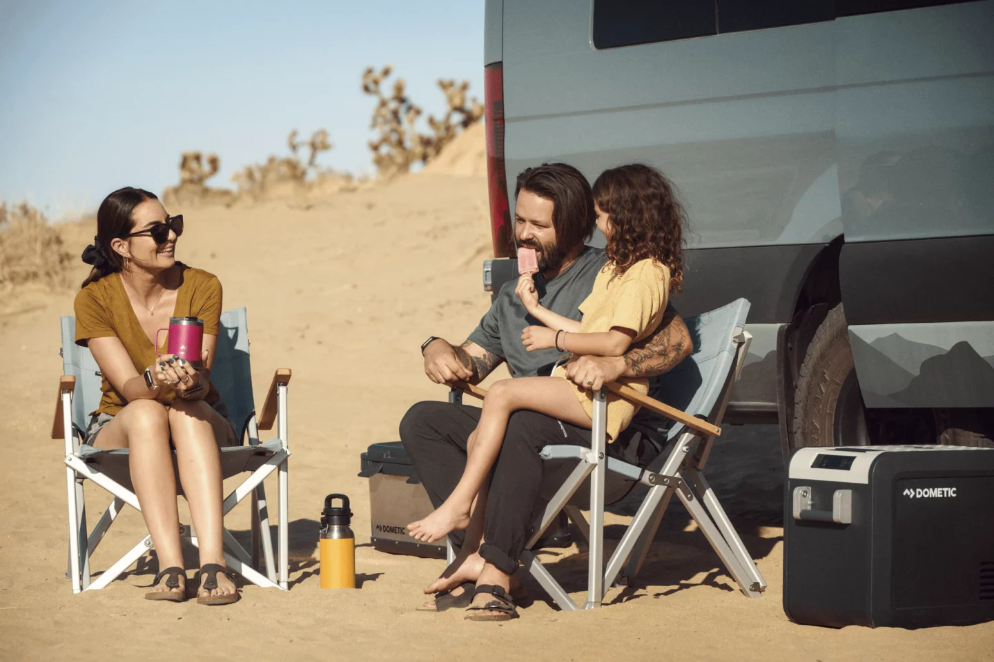Dometic's new Go folding camping chair and HC50 storage box team up with some of its older portable camping gear, including the CFX fridge on the far right