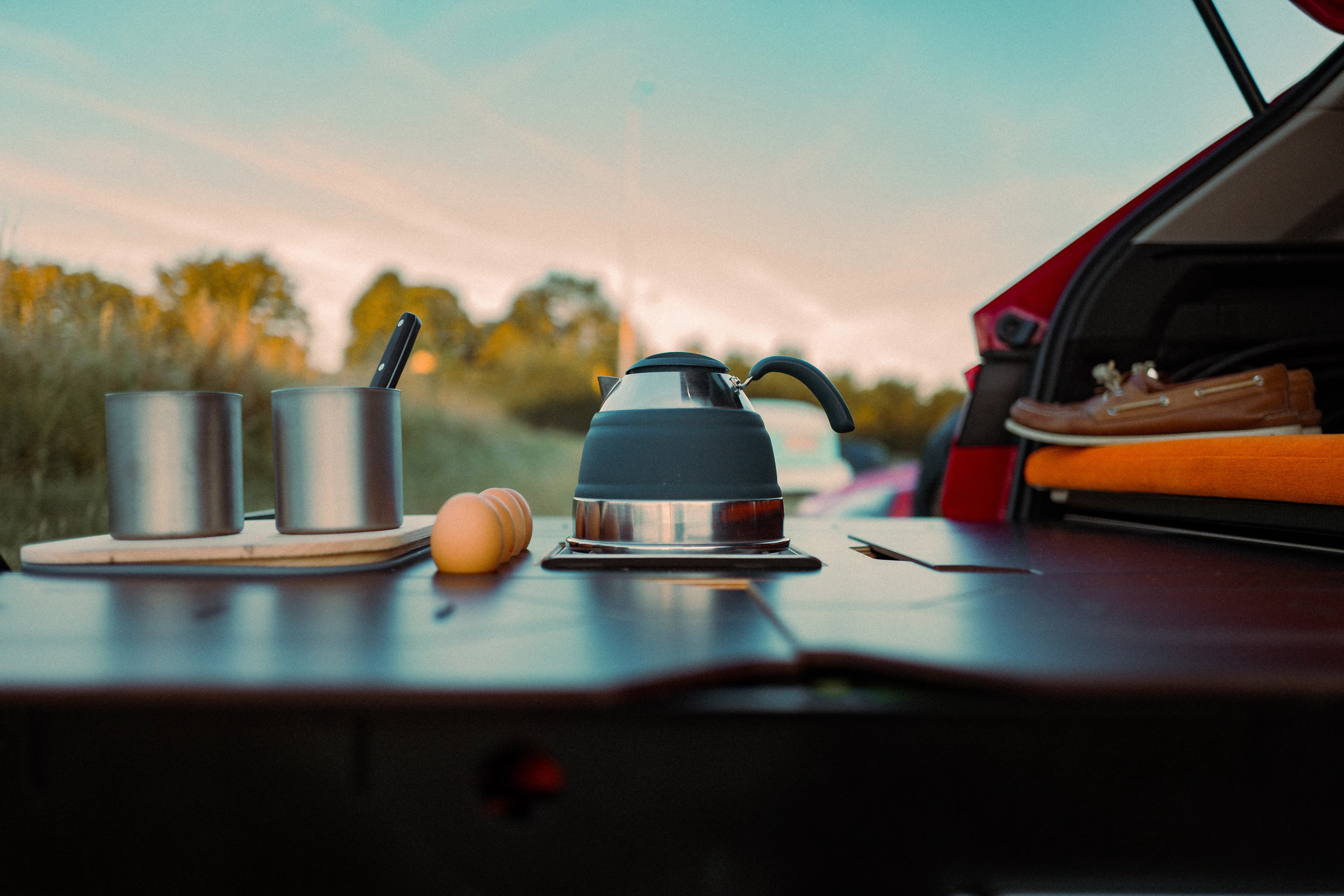 The lid over the collapsible sink basin (far left) serves as a counter