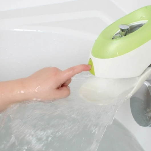 Boon's Flo multi-functional faucet cover