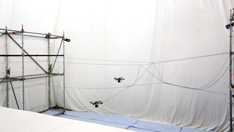 A fleet of quadcopters equipped with motorized spools of light-but-strong rope moved autonomously between two scaffolds at ETH Zürich's Institute for Dynamic Systems and Control, weaving a series of knots, links and braids across nine segments