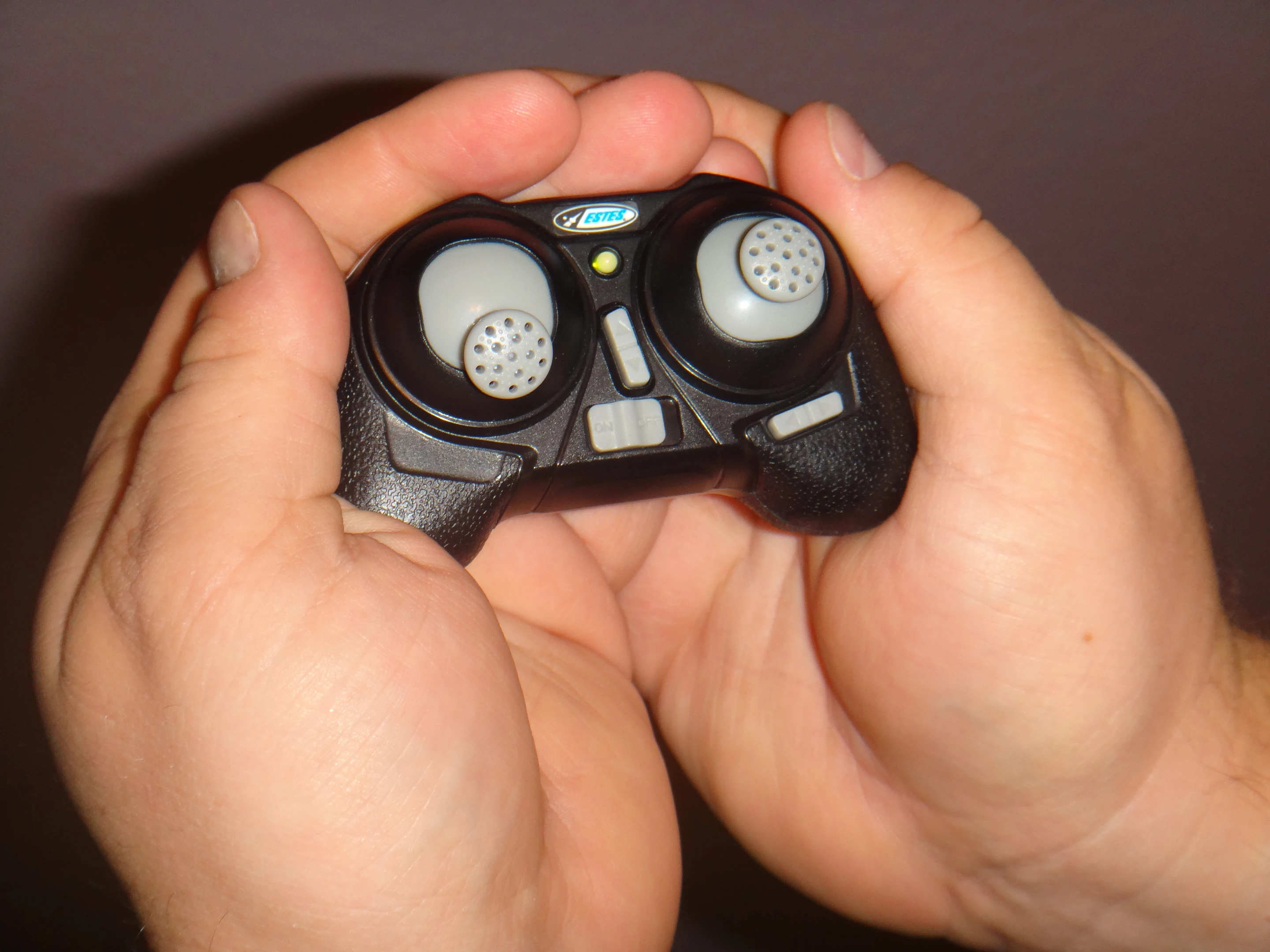 Holding the transmitter feels like holding a child's toy, especially if you have larger hands