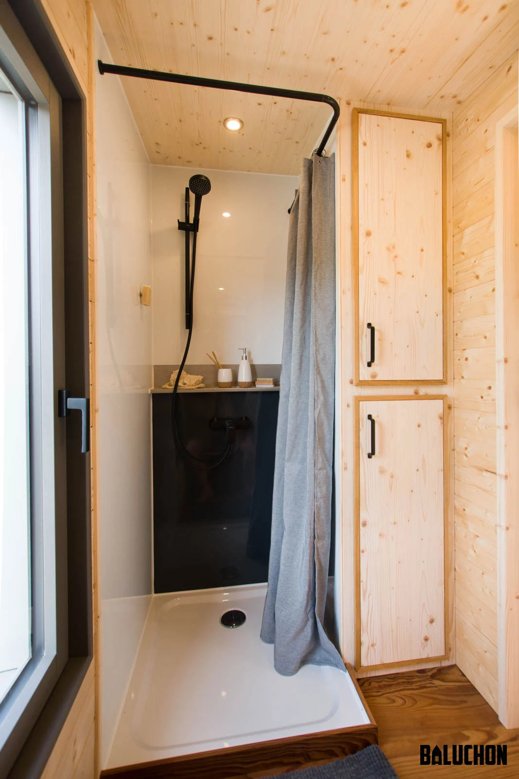 The Eucalyptus' bathroom includes a shower and toilet, plus some storage space for clothing