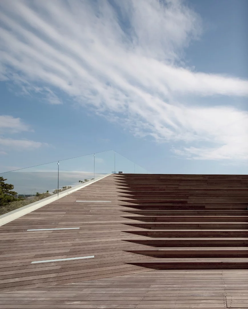 Designed by Heesoo Kwak and IDMM Architects, the Gijang Waveon cafe comprises three stacked forms that are placed to maximize the view
