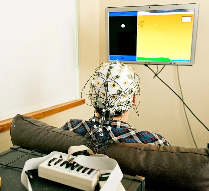 Using a combination of two kinds of non-invasive devices, the researchers were able to hook-up two brains in real time (Photo: Mary Levin, University of Washington)