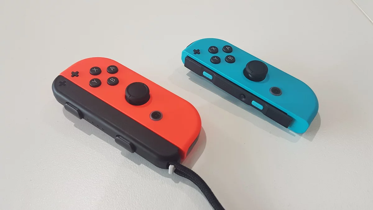 On the right is a naked Joy-Con, while the left one is wearing a clip-on strap – and it probably will be forever, considering how fiddly they are to take off