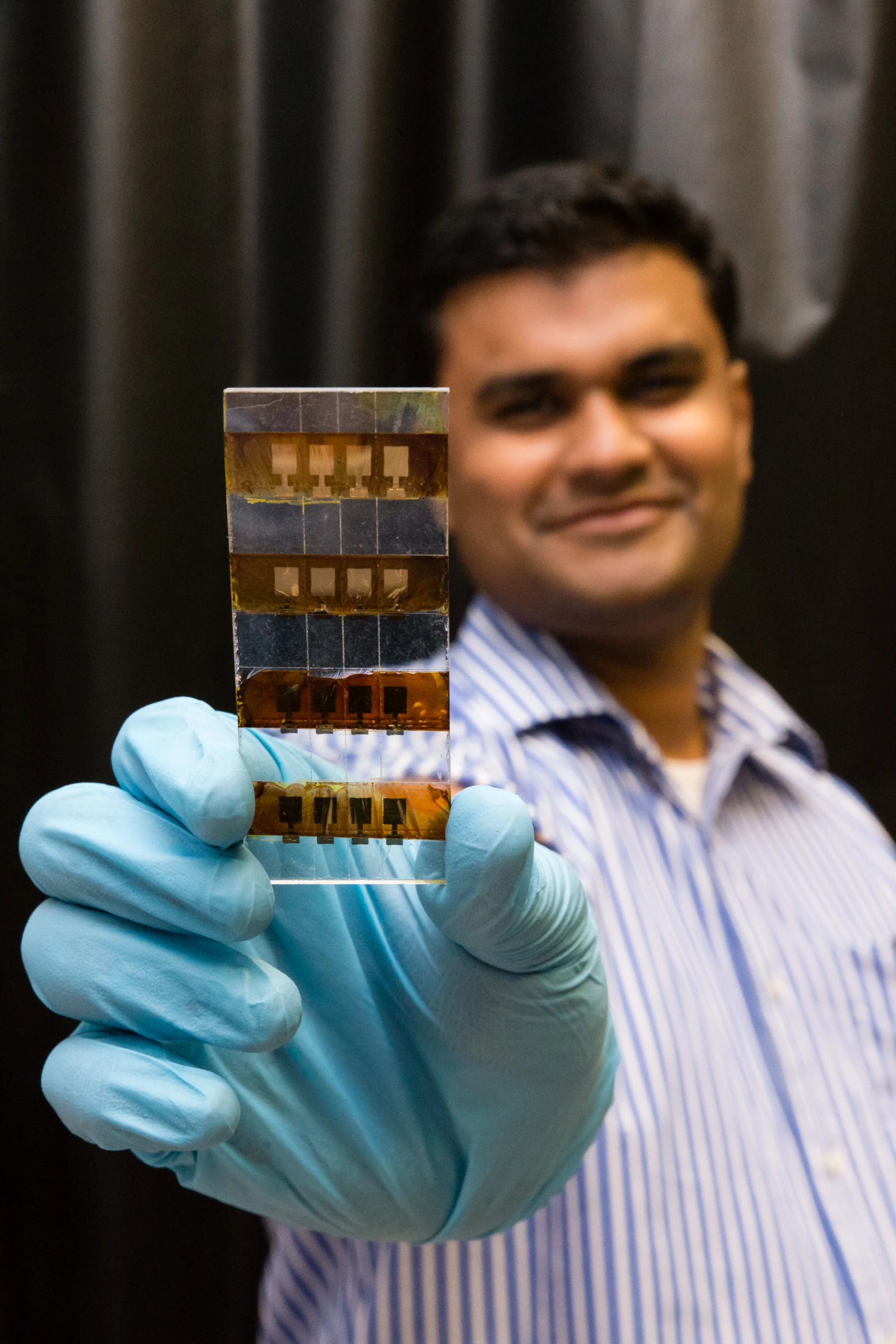 Assistant Professor Nripan Mathews holding the NTU Perosvkite solar cell (Photo: Nanyang Technological University)