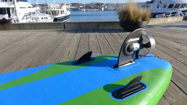 The motorized ElectraFin slides into the existing fin box on stand-up paddleboards