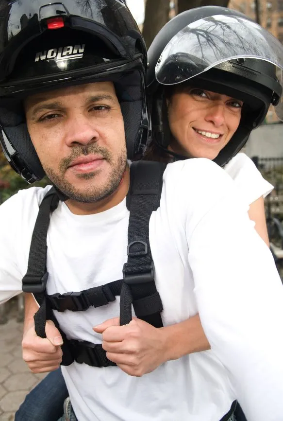 The Moto-Grip is a harness worn by a motorcycle operator, designed to let their passenger hang onto them better