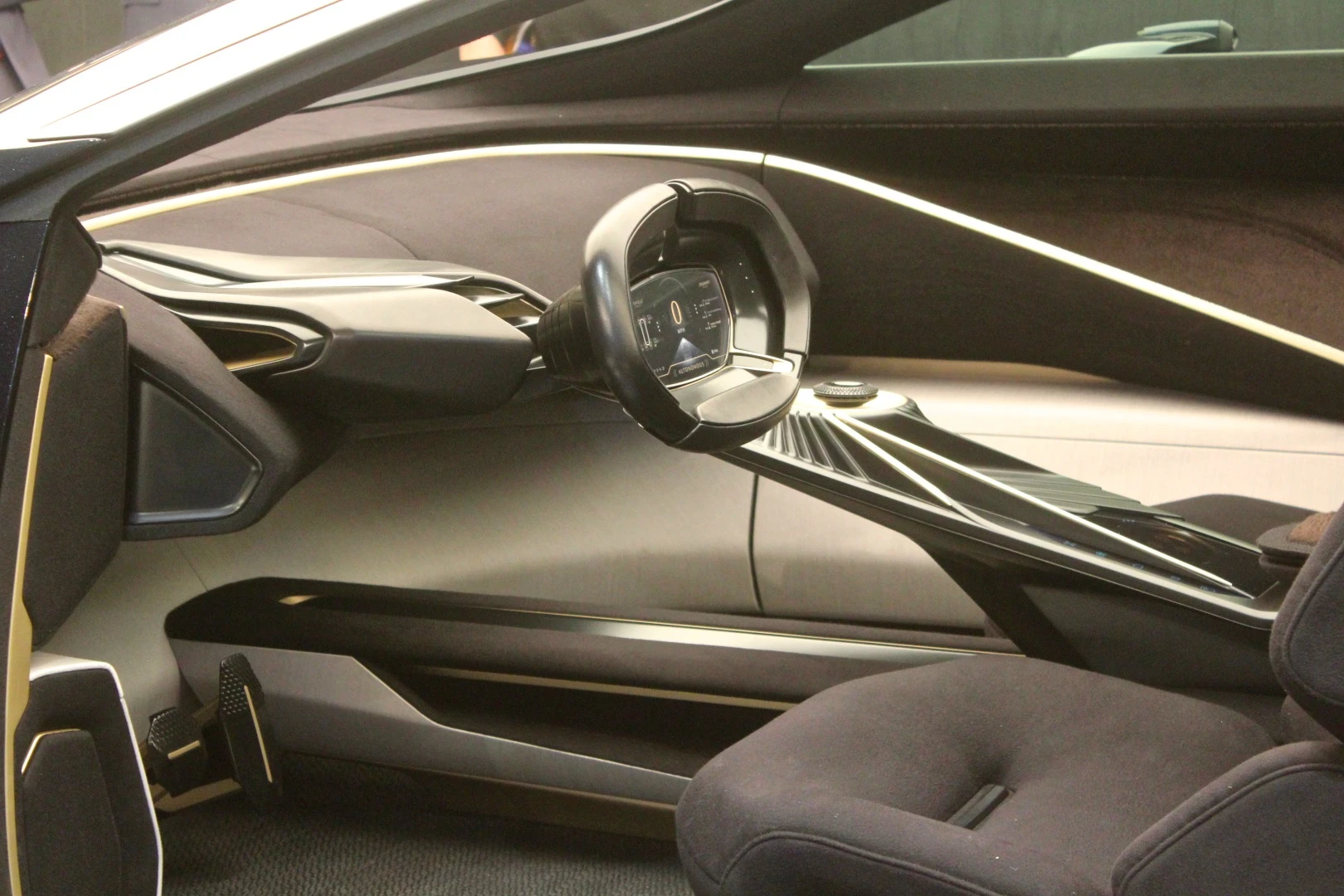 Inside, the new Aston Martin SUV conceptual has a swept-back sports car-like design language that is tempered by some more robust elements to the door sills and seating