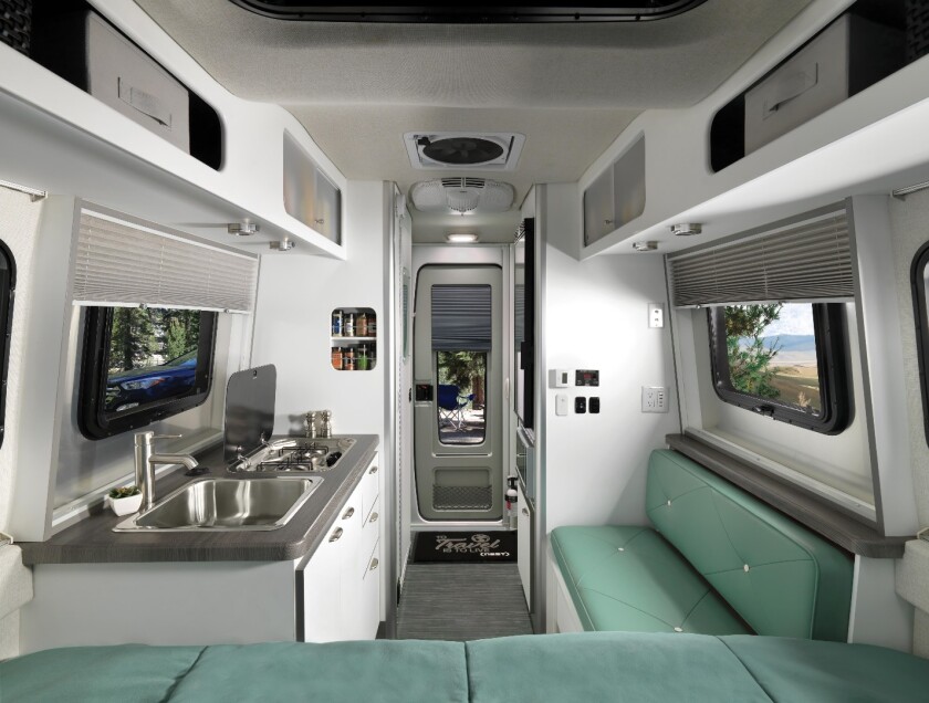 The 16FB floor plan comes with a fixed rear bed and small side bench with adjustable table