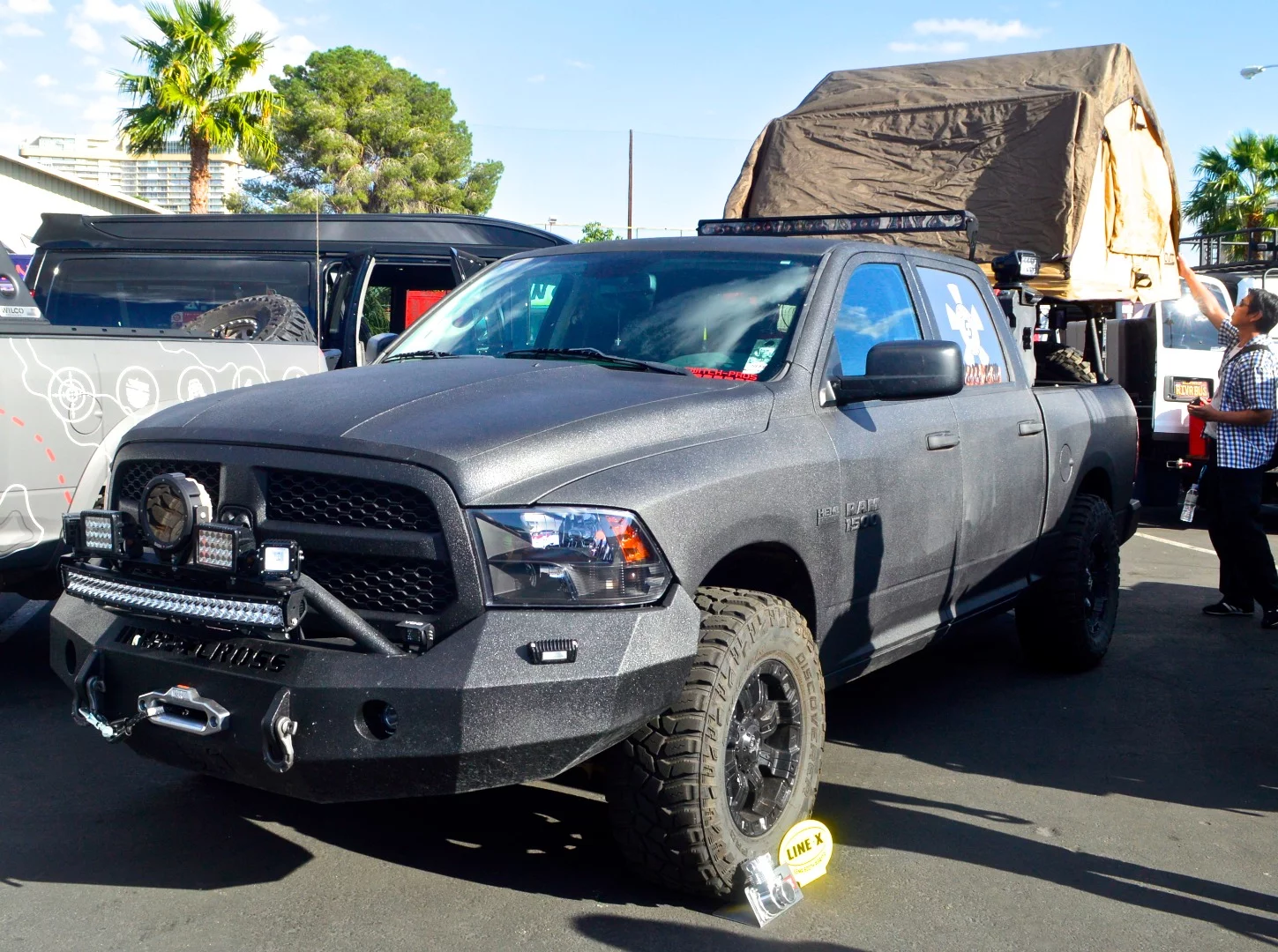 Ram 1500 pickup with bed rack-mounted roof-top tent