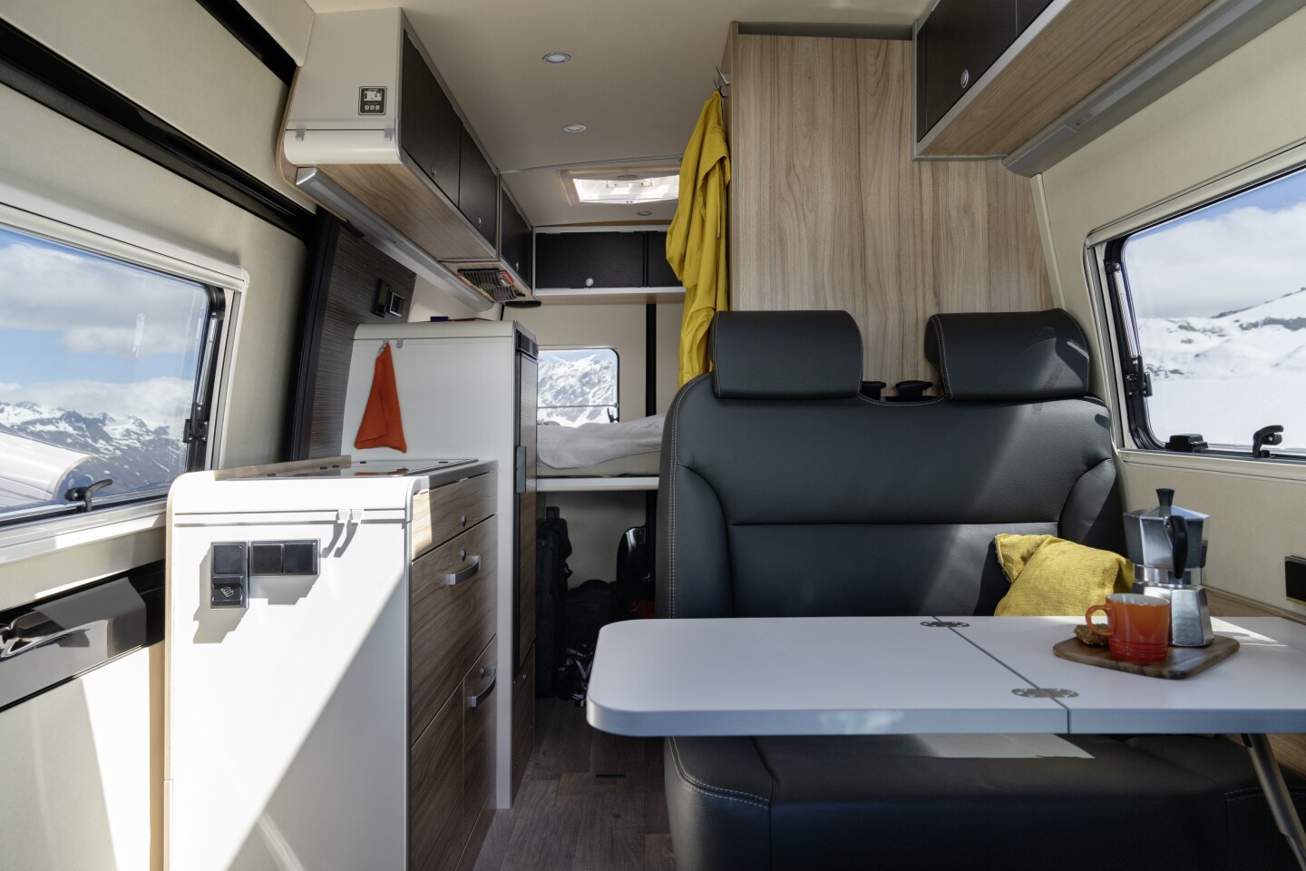 Looking back at the dinette, kitchen block and bedroom of the Hymer Grand Canyon S CrossOver