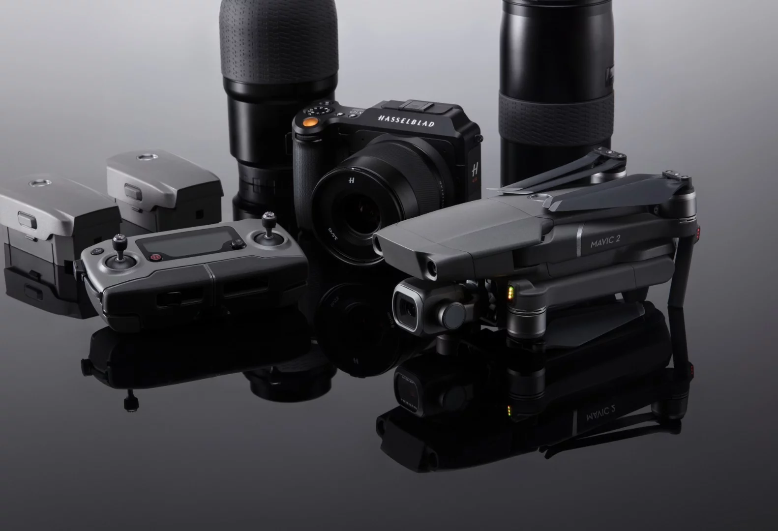 A modern videographer's field kit: a DSLR, some lenses and a DJI Mavic 2 Pro