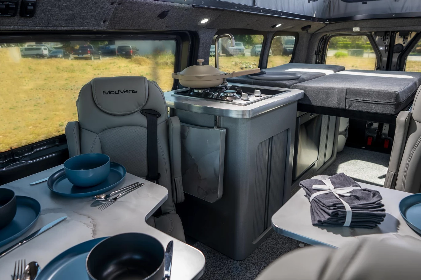 The CV1/X comes with only the two cab seats standard, but buyers can add up to five rear seats and two Lagun dining tables